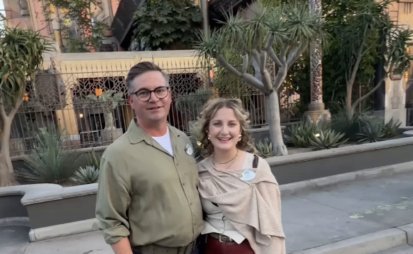 Jim & Lily smiling and standing in front of Guardians of the Galaxy: Mission Breakout