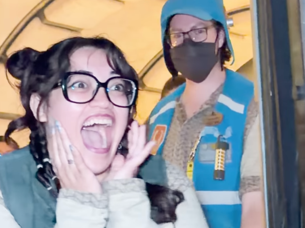 Woman Cast Member smiling and shocked 