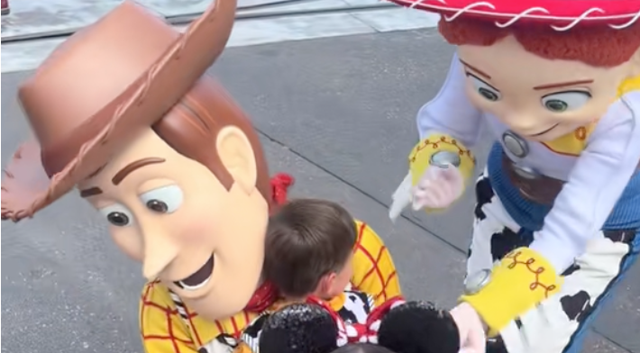 Little boy hugging Woody & Jessie