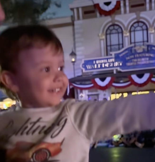 Little boy smiling at parade