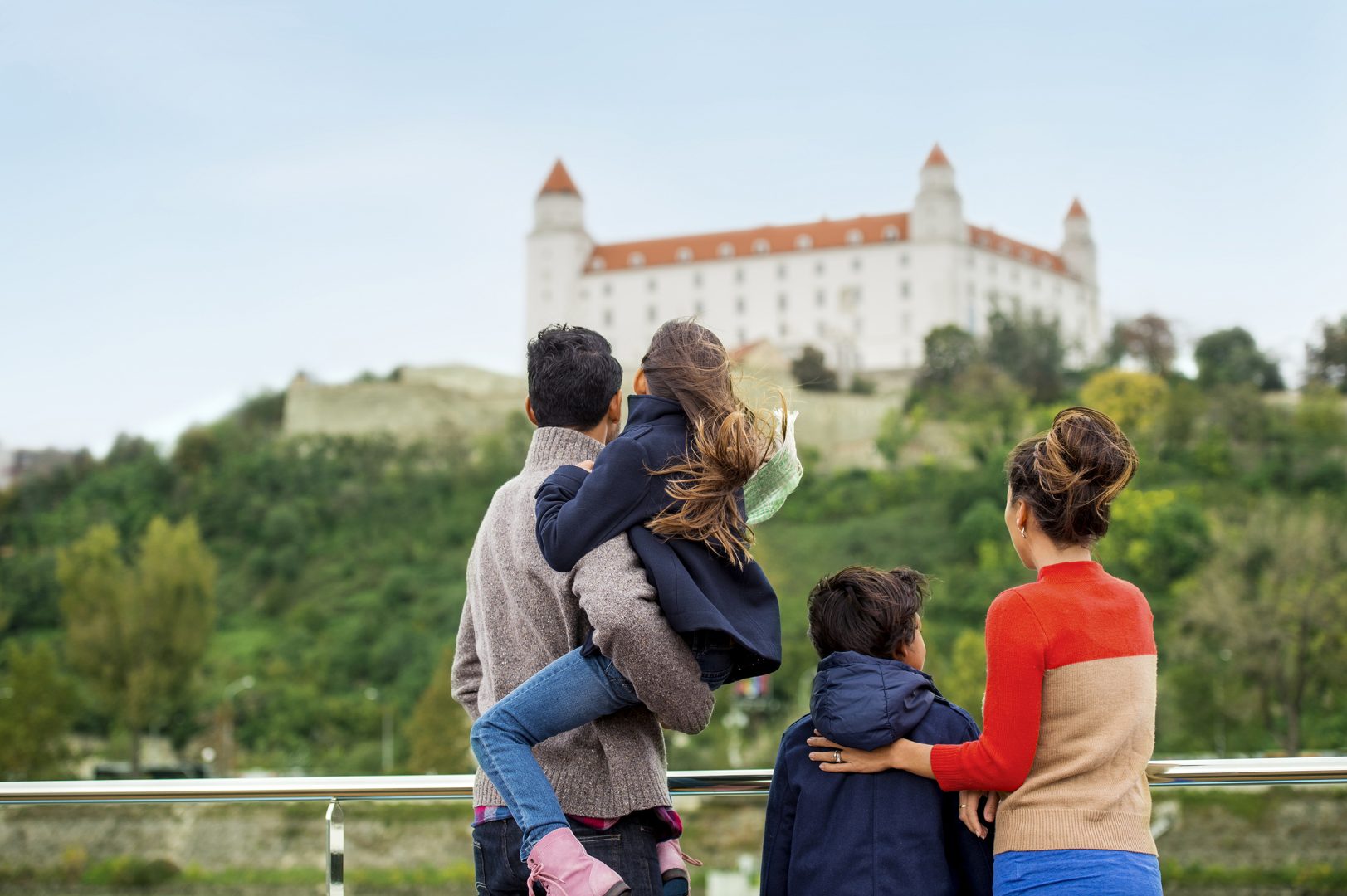 A family witnesses the beauty of one of the breathtaking locations during an Adventures by Disney River Cruise.