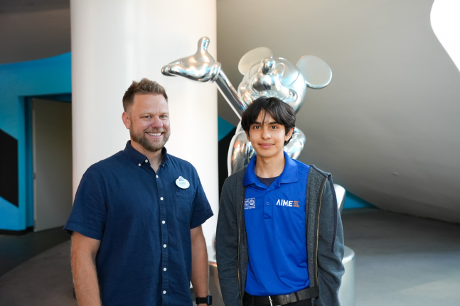 Disneyland Resort Content Strategy Manager Corey Collins and his mentee, Anthony, bond over their shared experiences.  