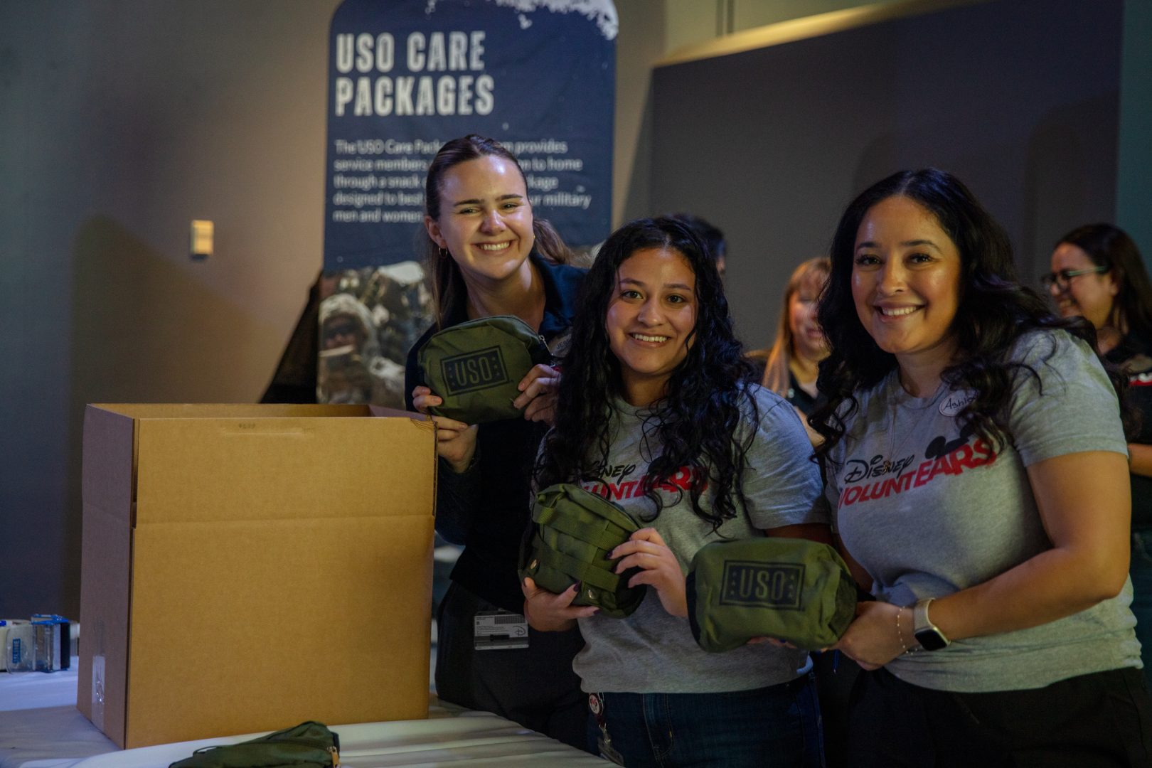 Disney VoluntEARS pack care kits to send to deployed U.S. service members. 