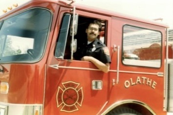 Fire Captain Mark Solano driving the firetruck at a station in Olathe, Kansas. 