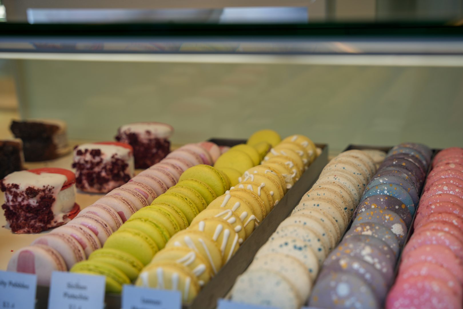 Rows of colorful French macarons awaits guests at the Kayla’s Cake cart in Downtown Disney District.